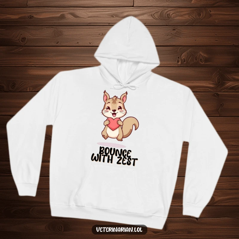 Funny hoodie with a lively squirrel bouncing a healthy heart icon, promoting energy and fun.