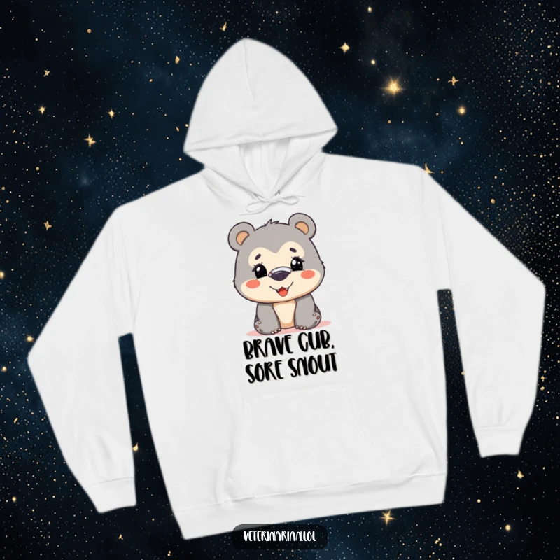 Funny bear cub hoodie featuring a curious cub with a nose bandage, smiling bravely, perfect for comfortable and humorous wear.