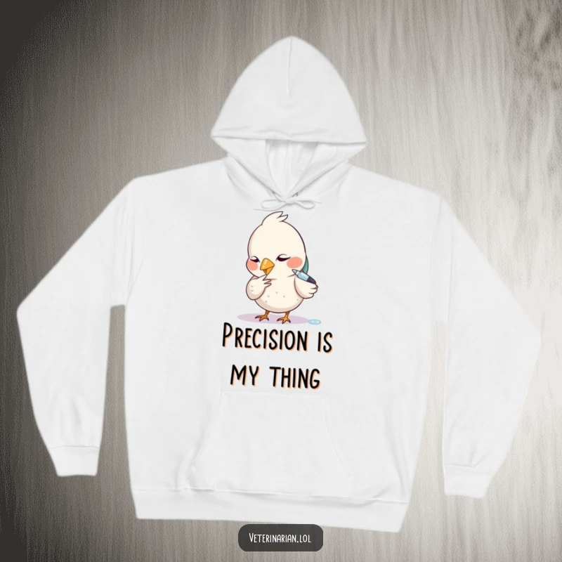 Funny hoodie showing a small bird carefully administering a tiny dropper with a focused expression.