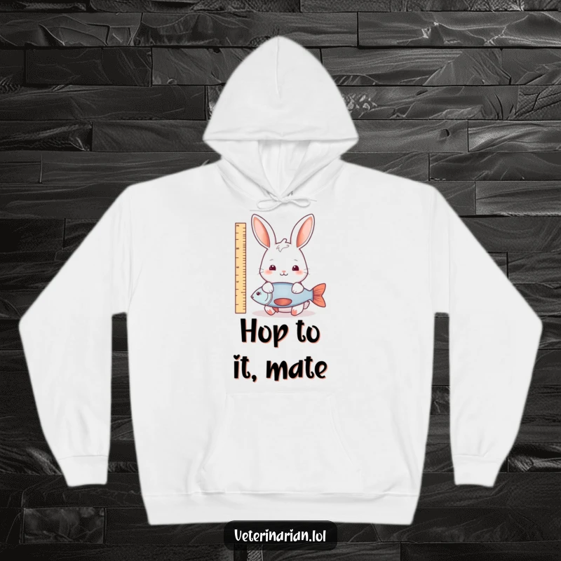 Funny rabbit fish measure hoodie showing a gentle rabbit measuring a fish with a ruler, symbolizing nature’s funny precision and calm observation.