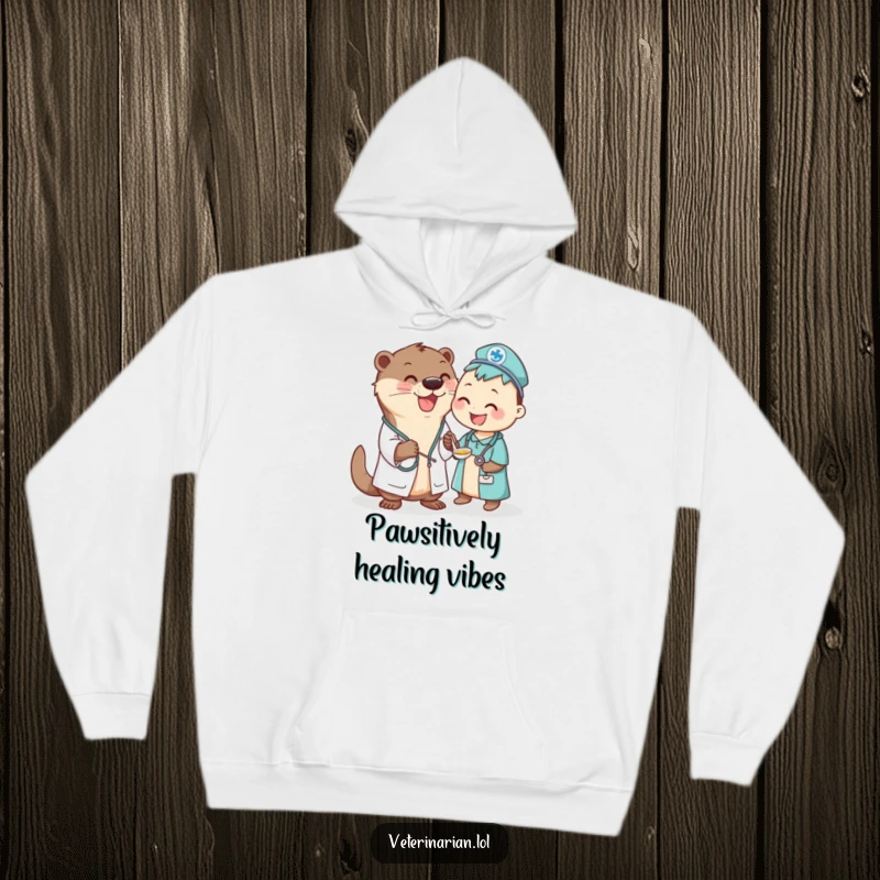 Funny Otter Vet Hoodie: Adorable otter veterinarian in a coat happily administers liquid medicine with a spoon to a patient.
